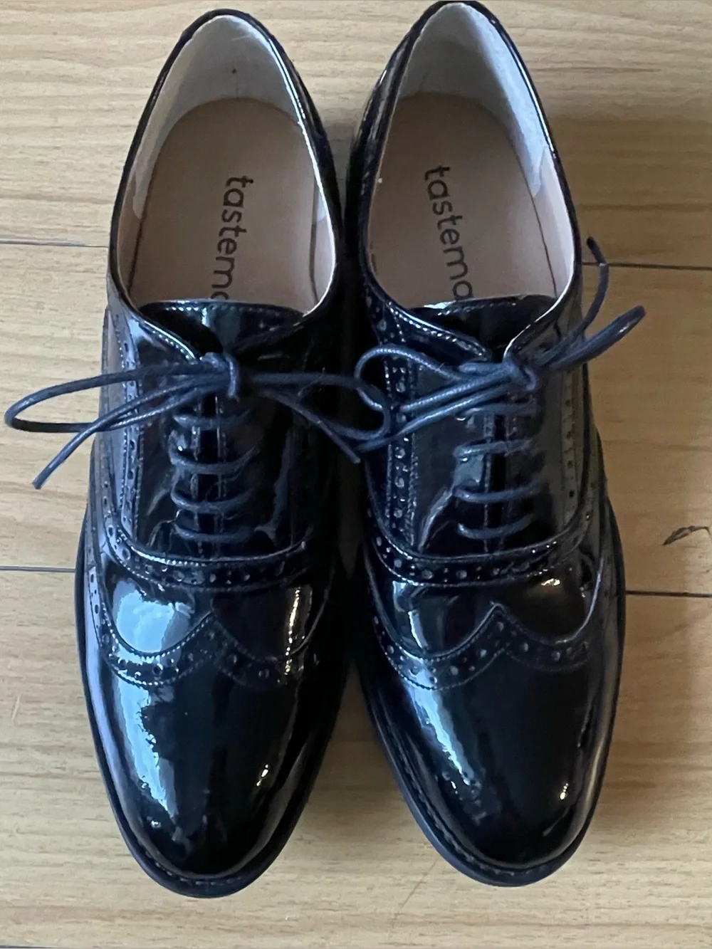Tastemaker Women’s Black Patent Wingtip Oxfords